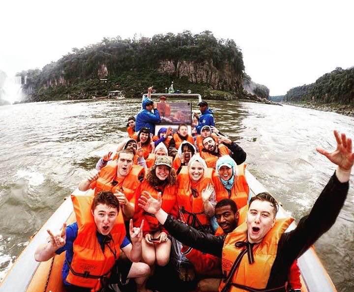 Students riding in a boat on Iguaçu Falls