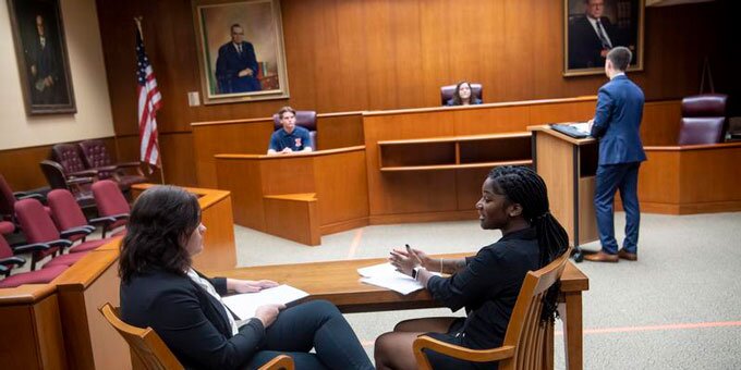 Students working in a court room