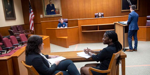 Students working in a court room