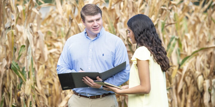 Instructor and student in field.