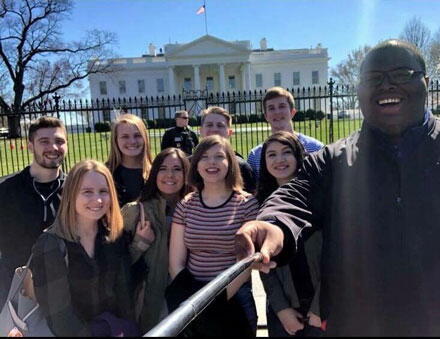 Students taking a selfie outside the White House in Washington, D.C.