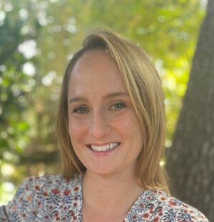 Alumna Molly Messner posing for headshot