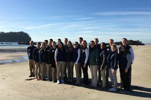 Students at a local beach and at the foot of Mount Manganui