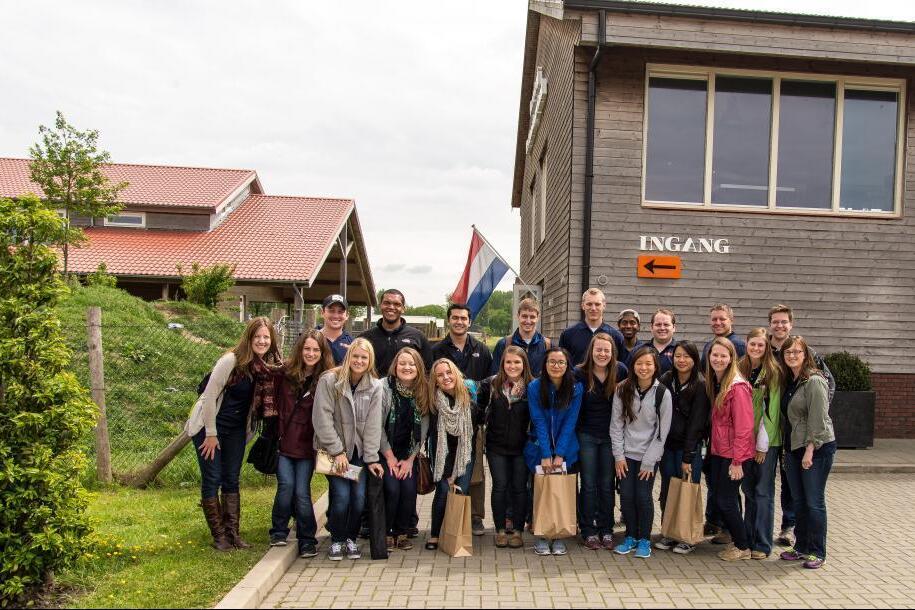 Students standing in front of a building