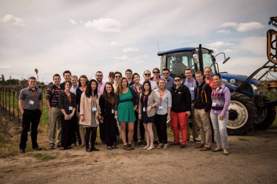 ACE students standing in front of a tractor